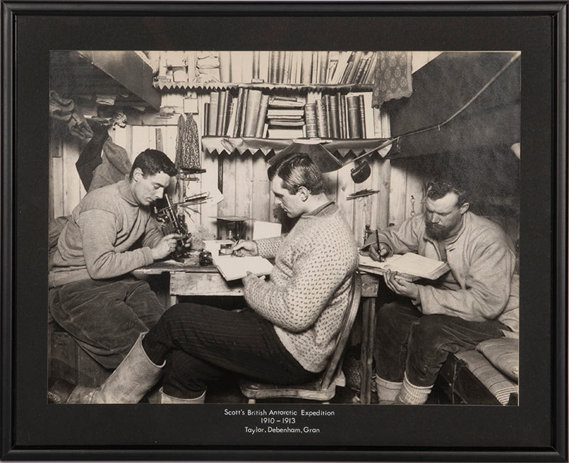 Classic Herbert Ponting photograph from Captain Scott's Terra Nova expedition (1910-1913), showing Taylor, Debenham and Gran in the Hut at Cape Evans