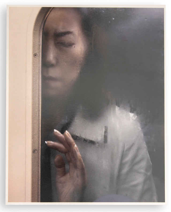 Tokyo Compression comprises Michael Wolf's candid photographs of Japanese commuters in Tokyo's crowded subway cars.