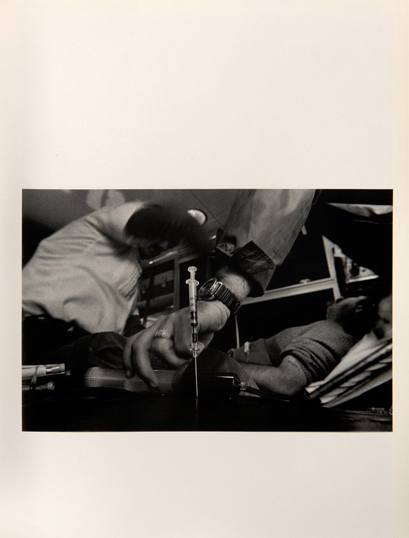 The Knife and Gun Club comprises Eugene Richard's photographs of the emergency room at Denver General Hospital, accompanied by texts from individuals who work there.