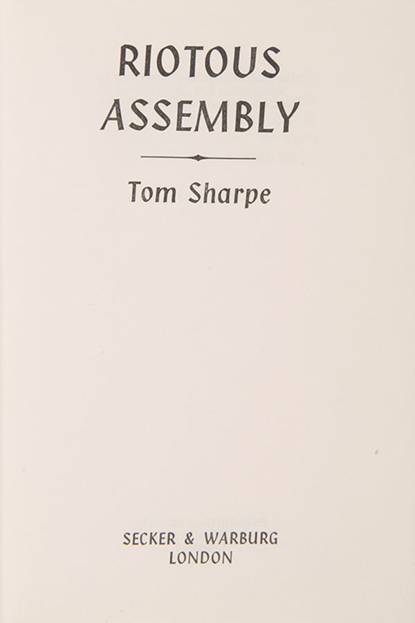 A very good first edition of Riotous Assembly, the satirical novel that made Tom Sharpe famous.