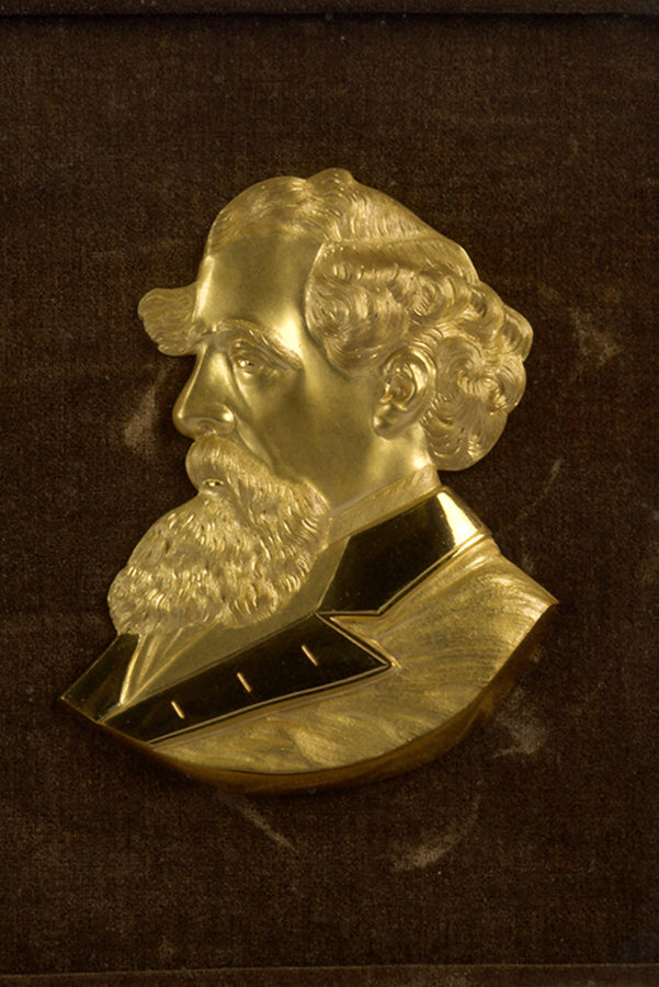 Head and shoulders gilt bronze relief bronze relief of Charles Dickens in profile, in a fine state of mounted on contemporary dark brown silver velvet.