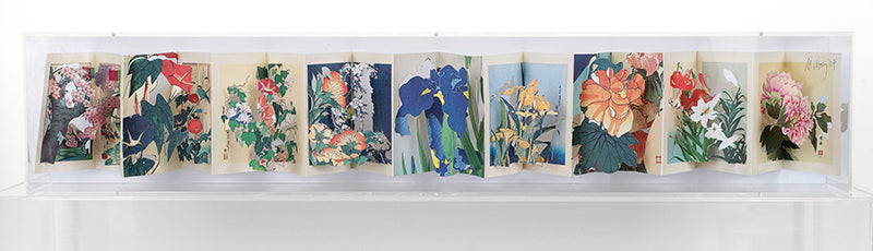 Cut Japanese book in an acrylic case by Jack Milroy, titled Orihon IV.