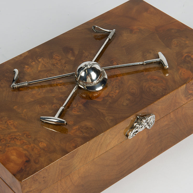 A very handsome Polo themed cigarette or cigar box with multiple uses for the non-smoker, with a pair of applied silver-plated polo mallets and helmet mounted on the lid