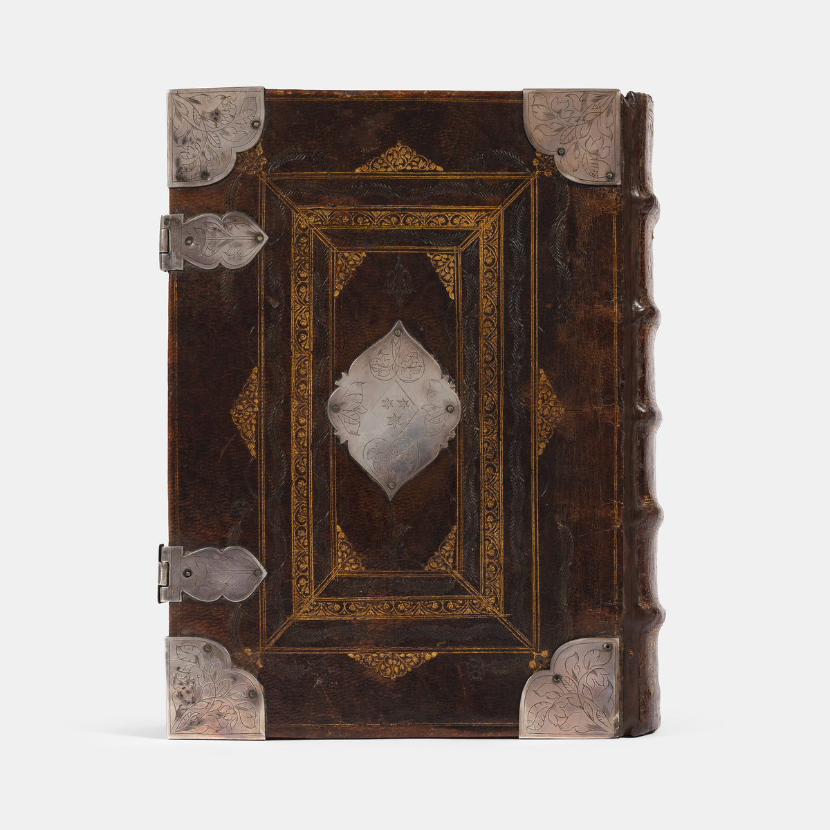 An impressive mid-seventeenth century King James Bible, splendidly preserved in an English Restoration binding of gilt panelled blackmorocco with silver furniture including the original working clasps