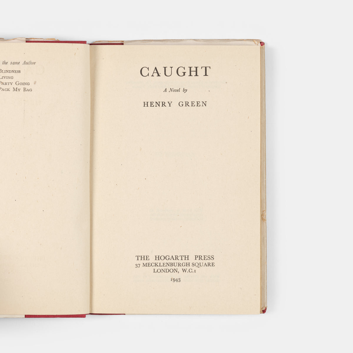 First edition, second impression of <em>Caught</em> by Henry Green, a novel inspired by his experiences as a member of London's Auxiliary Fire Service during the Blitz