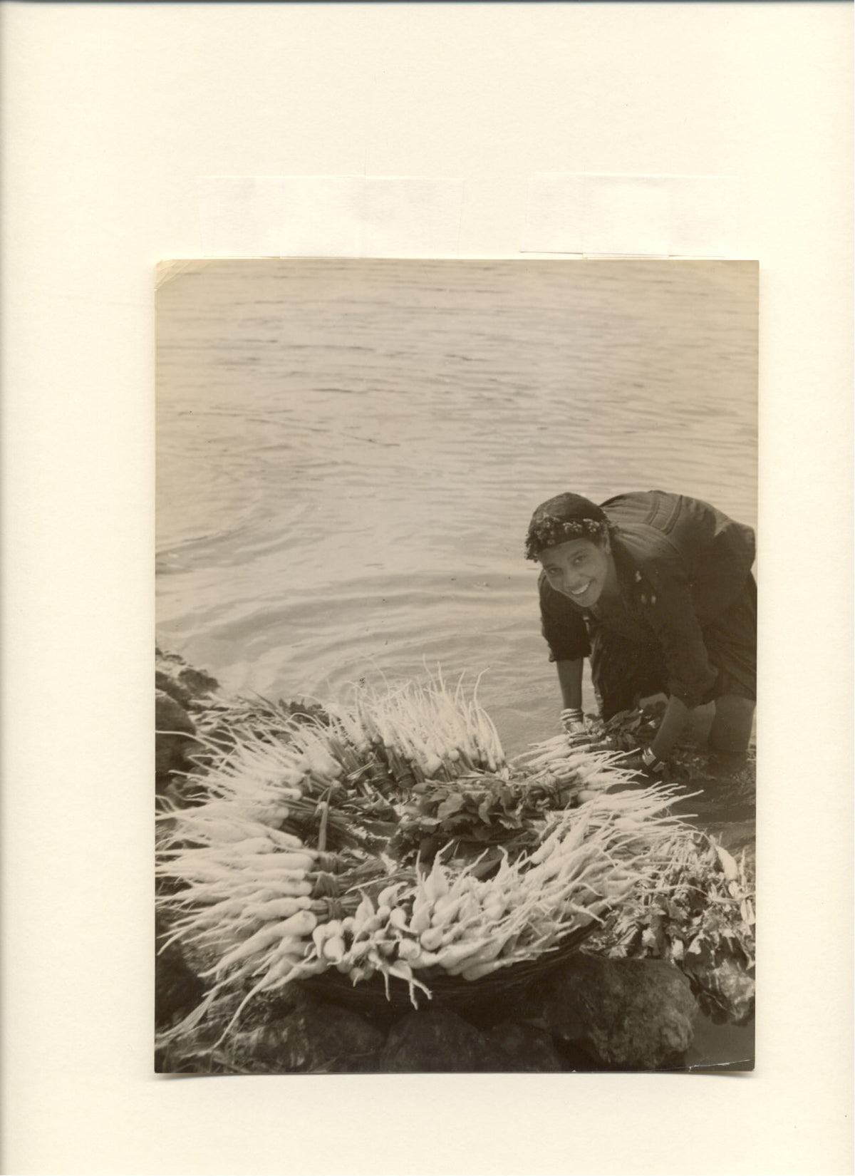 Egypt. Woman Washing Turnips In The Nile.