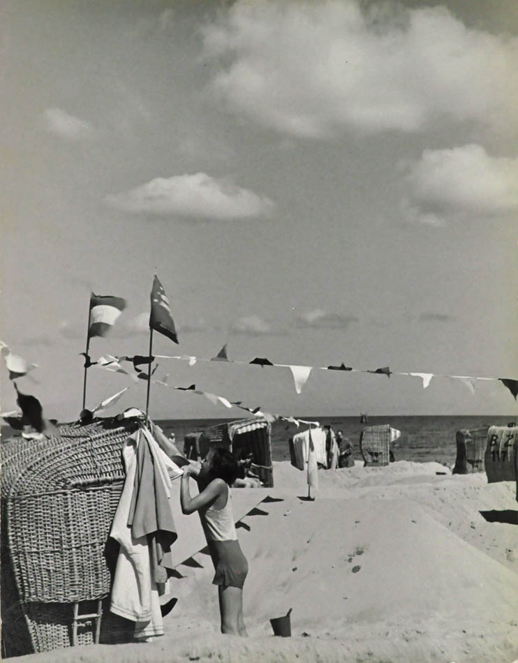 Beach Scene With Flags.