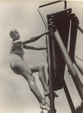 Woman Climbing The Diving Board.