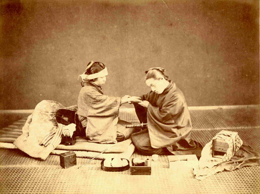 Samurai treating a woman.