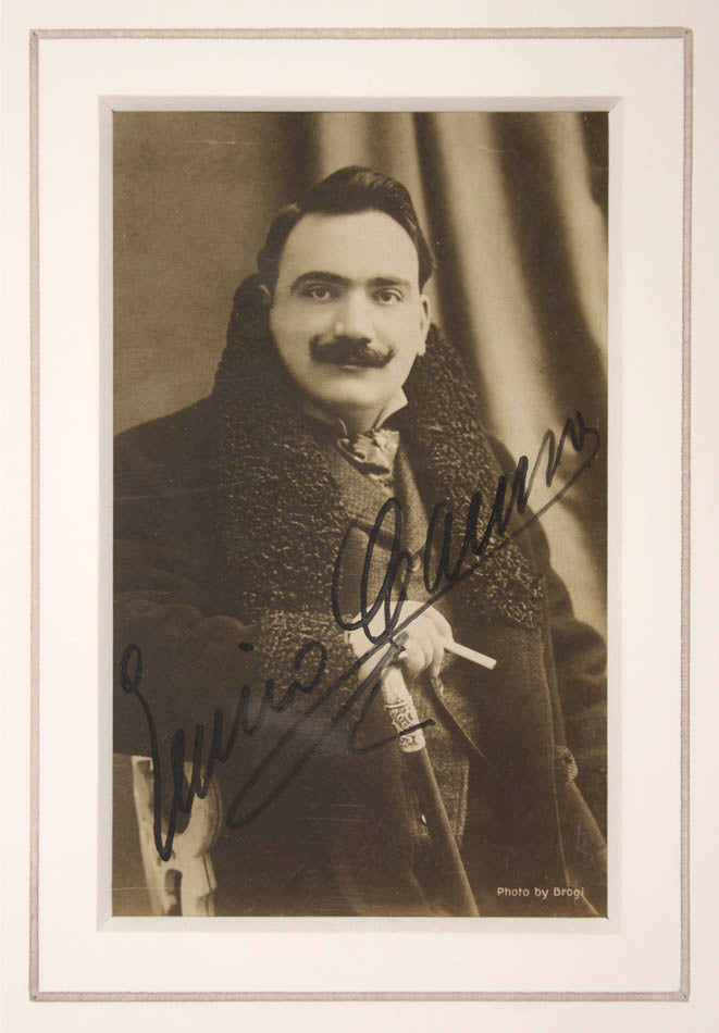 Opera singer, Caruso seated, signed boldly and diagonally upwards, 85 x 140mm (3 1/4 x 5 1/2 ins), mounted, 240 x 1295 mm (9 1/2 x 11 1/2 ins), near-fine