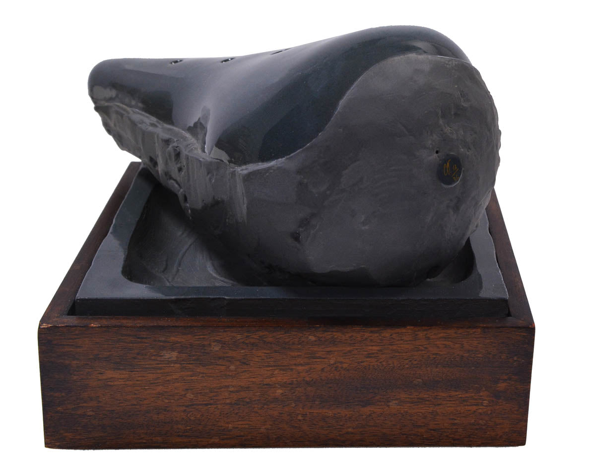Claes Oldenburg, Sculpture in the Form of a Bicycle Saddle, 1976, cast ceramic, mahogany, sand, signed, from the edition of 36