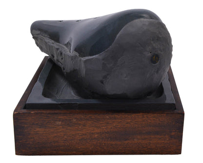 Claes Oldenburg, Sculpture in the Form of a Bicycle Saddle, 1976, cast ceramic, mahogany, sand, signed, from the edition of 36
