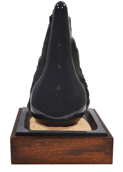 Claes Oldenburg, Sculpture in the Form of a Bicycle Saddle, 1976, cast ceramic, mahogany, sand, signed, from the edition of 36