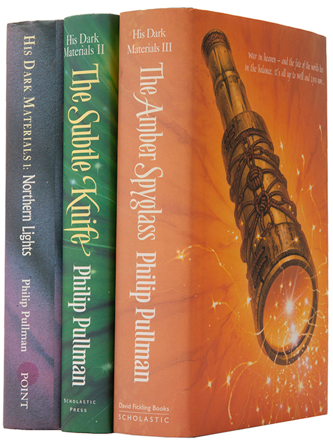 First UK editions of Philip Pullman's acclaimed fantasy trilogy His Dark Materials, signed by the author on the title of The Northern Lights.