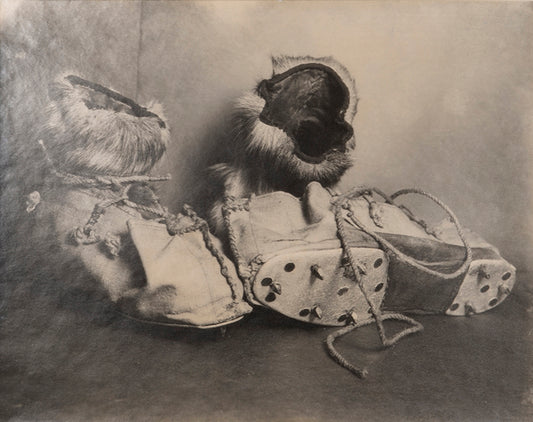 Classic Herbert Ponting photograph from Captain Scott's Terra Nova expedition (1910-1913), showing a pair or reindeer skin boots known as finnesko.