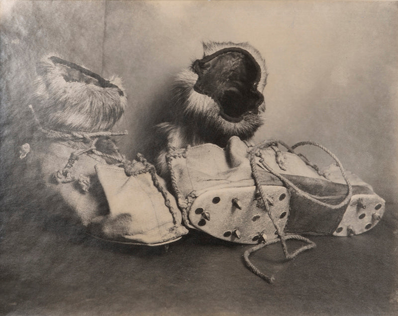 Classic Herbert Ponting photograph from Captain Scott's Terra Nova expedition (1910-1913), showing a pair or reindeer skin boots known as finnesko.