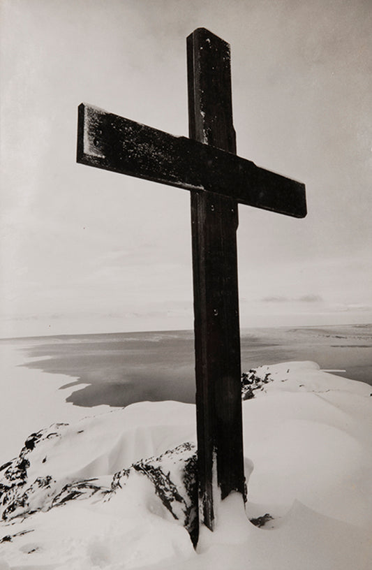 Classic Herbert Ponting photograph from Captain Scott's Terra Nova expedition (1910-1913), showing the memorial cross erected on Ross Island, Antarctica