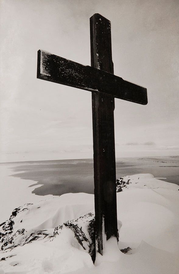 Classic Herbert Ponting photograph from Captain Scott's Terra Nova expedition (1910-1913), showing the memorial cross erected on Ross Island, Antarctica