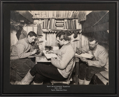 Classic Herbert Ponting photograph from Captain Scott's Terra Nova expedition (1910-1913), showing Taylor, Debenham and Gran in the Hut at Cape Evans