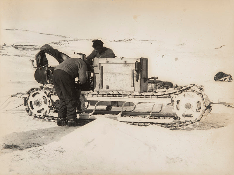 Classic Herbert Ponting photograph from Captain Scott's Terra Nova expedition (1910-1913), showing Day and Lashly with one of the motor sledges.