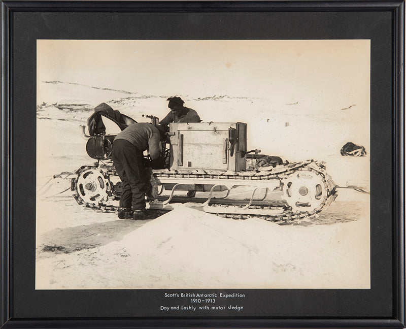 Classic Herbert Ponting photograph from Captain Scott's Terra Nova expedition (1910-1913), showing Day and Lashly with one of the motor sledges.