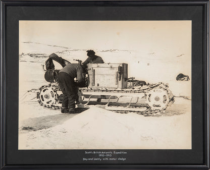 Classic Herbert Ponting photograph from Captain Scott's Terra Nova expedition (1910-1913), showing Day and Lashly with one of the motor sledges.