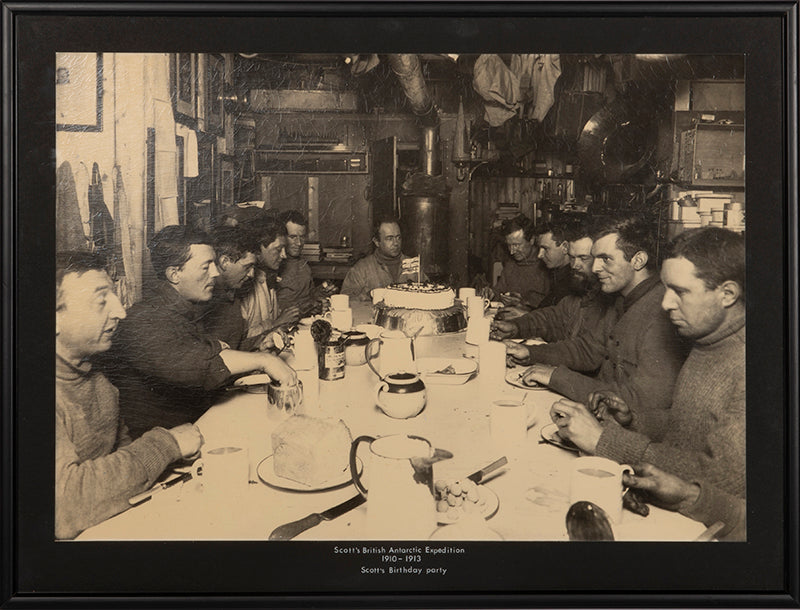 Classic photograph by Herbert Ponting from Captain Scott's Terra Nova expedition (1910-1913) showing Captain Scott's last birthday dinner.