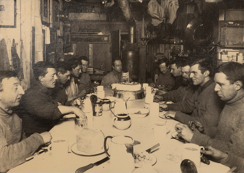 Classic photograph by Herbert Ponting from Captain Scott's Terra Nova expedition (1910-1913) showing Captain Scott's last birthday dinner.