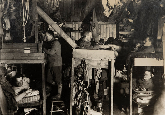 Classic Herbert Ponting photograph from Captain Scott's Terra Nova expedition (1910-1913), showing the Tenements, the officer's bunks in the Hut