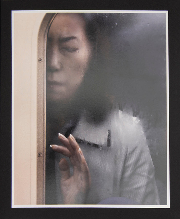 Tokyo Compression comprises Michael Wolf's candid photographs of Japanese commuters in Tokyo's crowded subway cars.