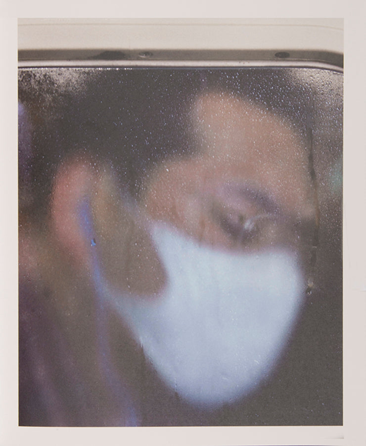 Tokyo Compression comprises Michael Wolf's candid photographs of Japanese commuters in Tokyo's crowded subway cars.