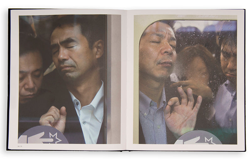Tokyo Compression comprises Michael Wolf's candid photographs of Japanese commuters in Tokyo's crowded subway cars.