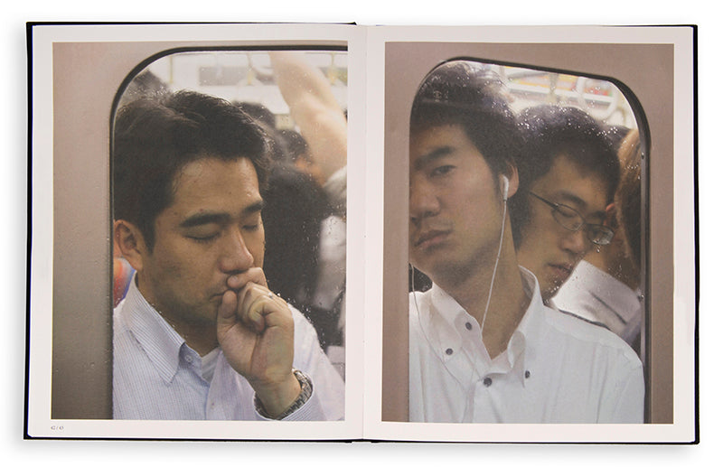 Tokyo Compression comprises Michael Wolf's candid photographs of Japanese commuters in Tokyo's crowded subway cars.