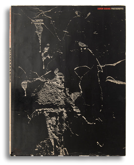 A presentation copy of Aaron Siskind's first monograph, inscribed to antique costumes and textiles dealer Cora Ginsburg.