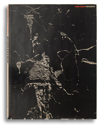 A presentation copy of Aaron Siskind's first monograph, inscribed to antique costumes and textiles dealer Cora Ginsburg.