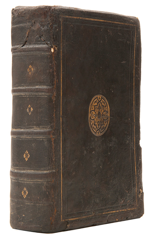 The first edition printed in England of Jean Calvin's Institutes of the Christian Religion, in a contemporary English gilt calf binding.
