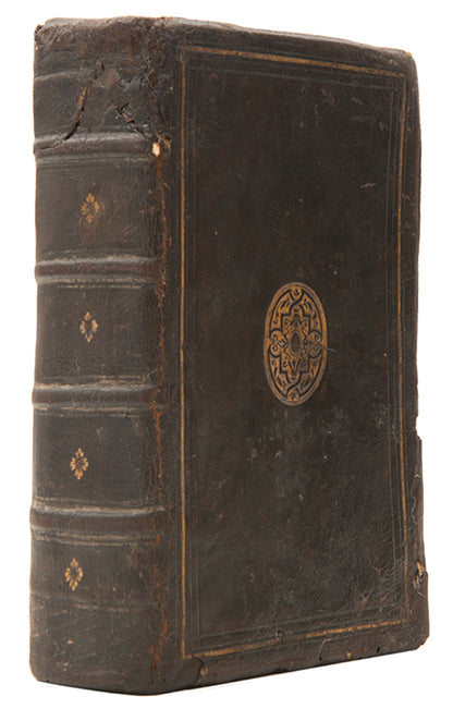The first edition printed in England of Jean Calvin's Institutes of the Christian Religion, in a contemporary English gilt calf binding.