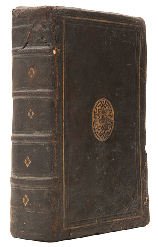 The first edition printed in England of Jean Calvin's Institutes of the Christian Religion, in a contemporary English gilt calf binding.