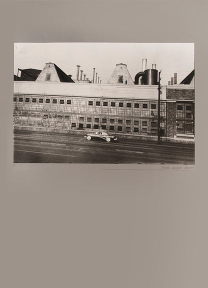 Robert Frank's Flower Is consists of three bodies of work. It begins with photographs taken in Paris of flowers, flower sellers, and chance encounters on the street, continues in a car factory in Detroit, and ends with polaroids made in Mabou Mines, Nova Scotia.