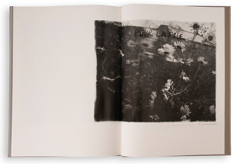 Robert Frank's Flower Is consists of three bodies of work. It begins with photographs taken in Paris of flowers, flower sellers, and chance encounters on the street, continues in a car factory in Detroit, and ends with polaroids made in Mabou Mines, Nova Scotia.