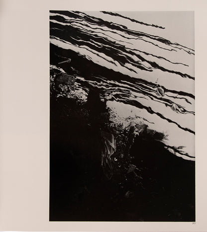 Morinaga Jun's photographs in River, its shadow of shadows of polluted Tokyo rivers foreshadow W. Eugene Smith's decision to document the fallout from polluted waters in Minamata.