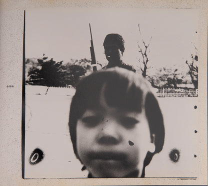 Mind Games is Suzuki Kiyoshi's third book, taking its title from a song by John Lennon. The Japanese title refers to the first chapter, 'People under the Tent,' which contains photographs of a travelling circus troupe that invoked memories for Suzuki of his childhood. 