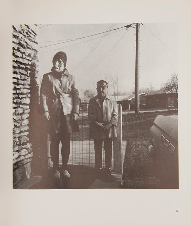 This is Ralph Eugene Meatyard's best-known work, for which he cast his wife Madelyn as the mask-wearing central character Lucybelle Crater, a name adapted from a character in a Flannery O'Connor short story.