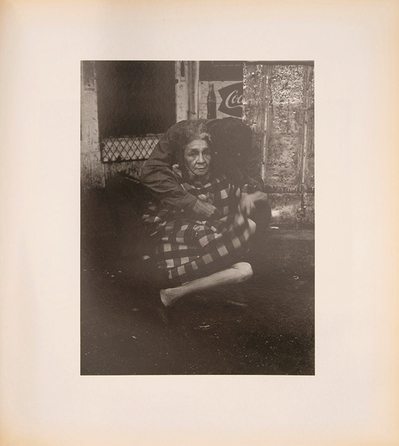 Bruce Davidson regularly visited East Harlem with a view camera and tripod with which he photographed the residents of a city block on East 100th Street between First and Second Avenues in New York. Davidson chose this block because, at the time, it had a reputation as being one of the worst in the city.