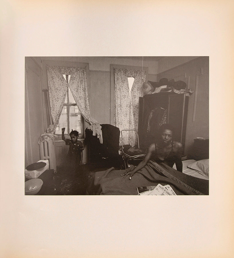 Bruce Davidson regularly visited East Harlem with a view camera and tripod with which he photographed the residents of a city block on East 100th Street between First and Second Avenues in New York. Davidson chose this block because, at the time, it had a reputation as being one of the worst in the city.
