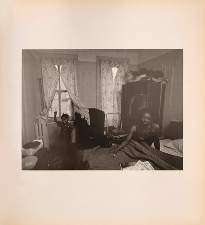 Bruce Davidson regularly visited East Harlem with a view camera and tripod with which he photographed the residents of a city block on East 100th Street between First and Second Avenues in New York. Davidson chose this block because, at the time, it had a reputation as being one of the worst in the city.