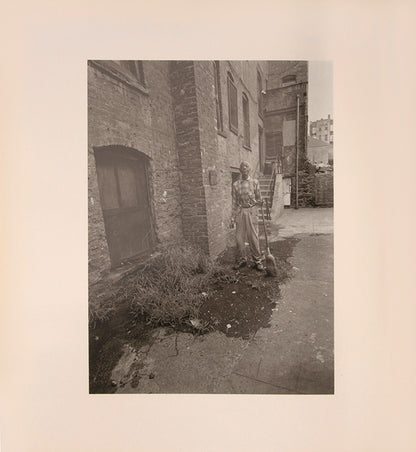 Bruce Davidson regularly visited East Harlem with a view camera and tripod with which he photographed the residents of a city block on East 100th Street between First and Second Avenues in New York. Davidson chose this block because, at the time, it had a reputation as being one of the worst in the city.
