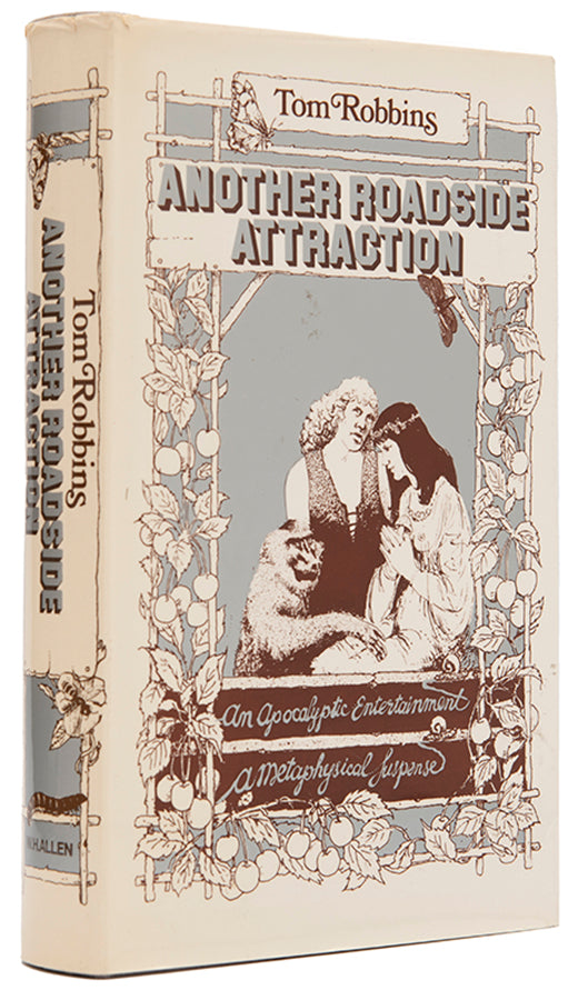 First UK edition of Another Roadside Attraction by Tom Robbins, with a signed photograph loosely inserted.
