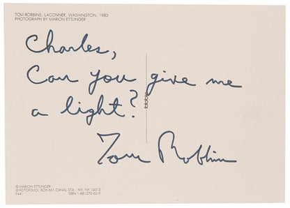 First UK edition of Another Roadside Attraction by Tom Robbins, with a signed photograph loosely inserted.