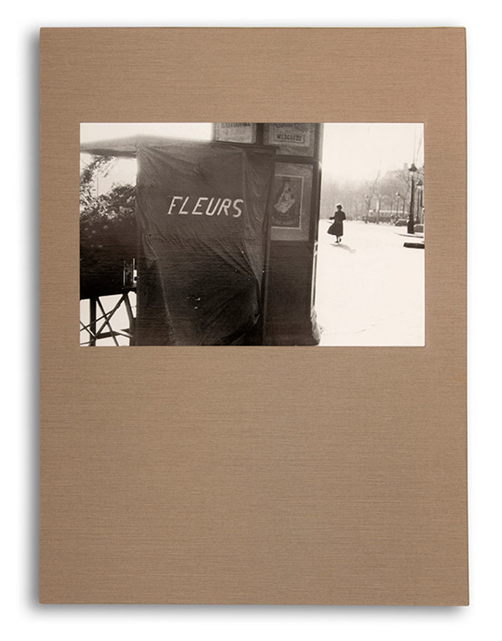 Robert Frank's Flower Is consists of three bodies of work. It begins with photographs taken in Paris of flowers, flower sellers, and chance encounters on the street, continues in a car factory in Detroit, and ends with polaroids made in Mabou Mines, Nova Scotia.